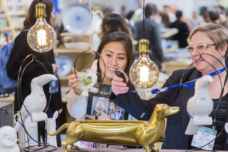 Two attendees explore tabletop at a previous market. Courtesy NY NOW.