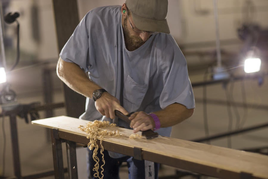 An inmate crafting hardwood floor at a prison outside Nashville.