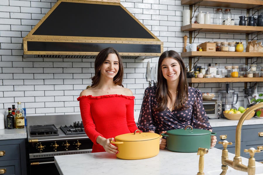 Great Jones founders Sierra Tishgart and Maddy Moelis with the brand's cast iron Dutch oven