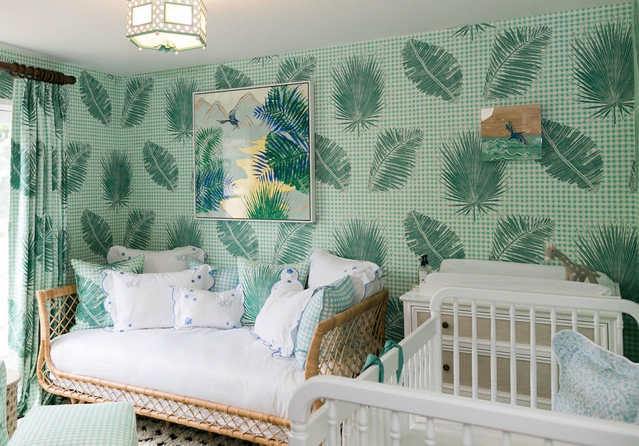 A nursery in Krane Home wallpaper