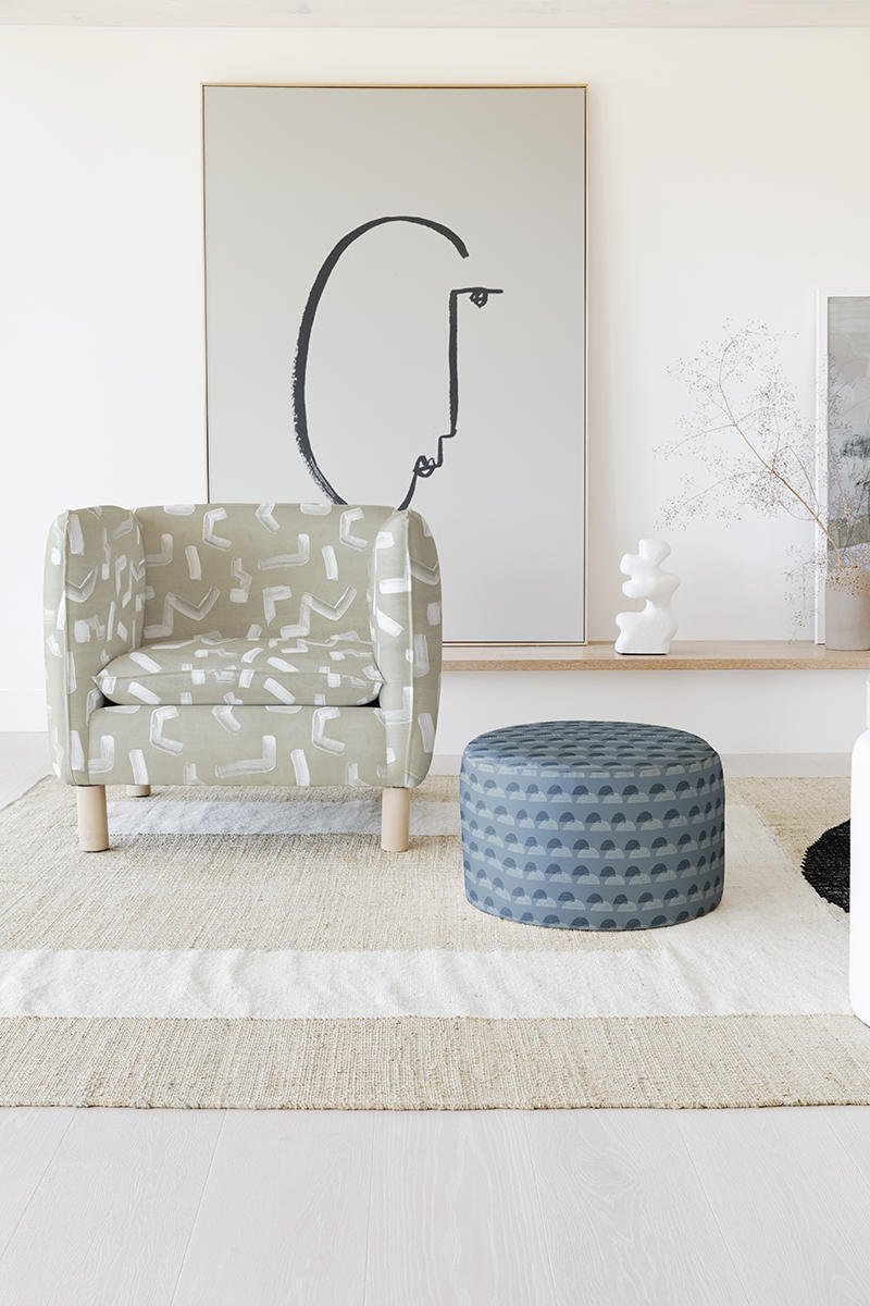 Brushstroke by Nashville, Tennessee–based artist Angela Simeone appears on the armchair, while the ottoman is upholstered in Finesse by Alicia Youngken of Atlanta.