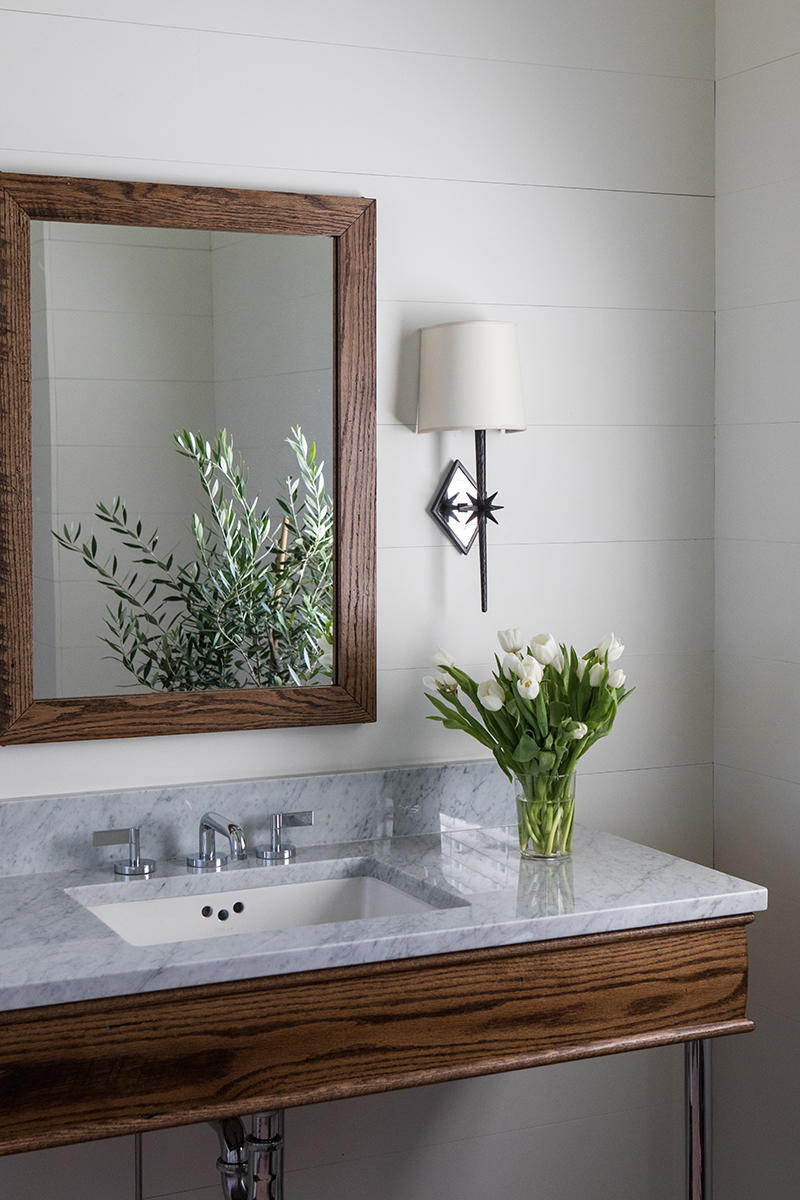 A refined vanity in a simple bath space.