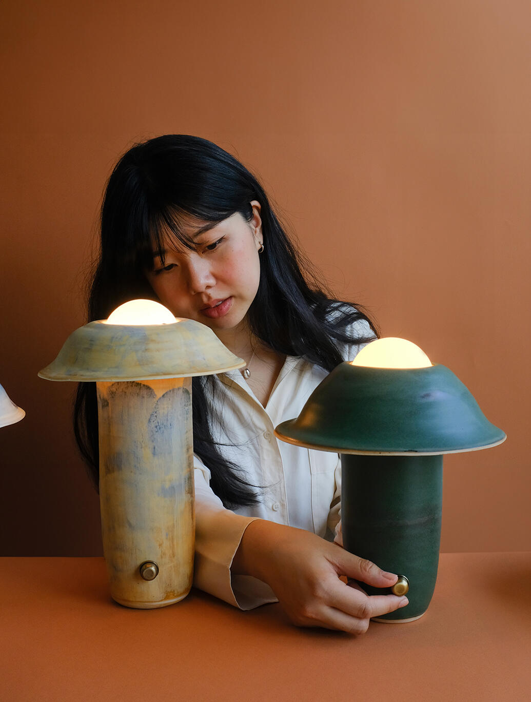 Steffany Trần pictured with her lighting collection