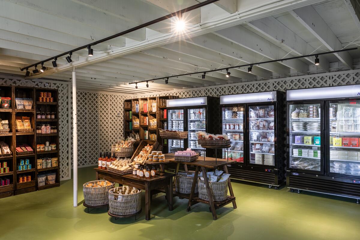 The market section of the shop features a mix of gourmet prepared foods