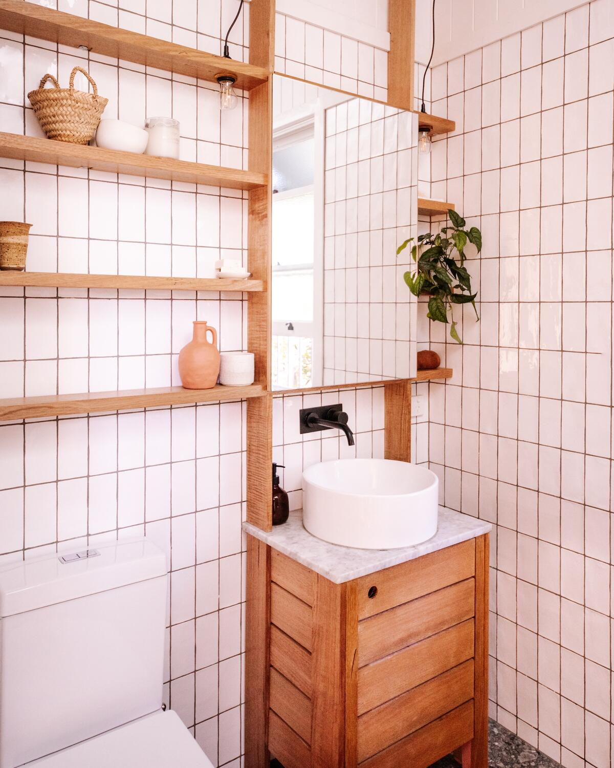 Vertical storage adds functionality to a petite bathroom 
