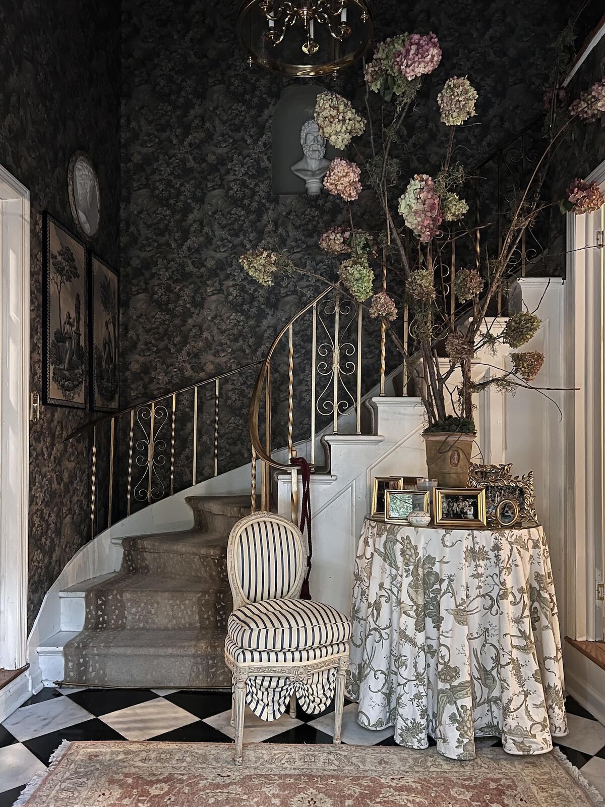 A foyer designed by Kontrafouris, who prefers to source secondhand furniture in her work