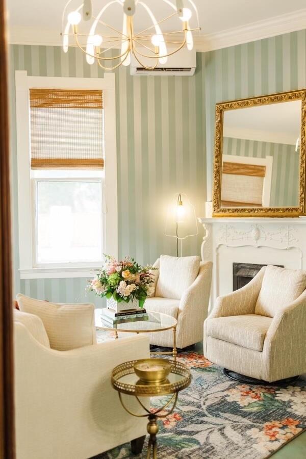 Brass finishes gleam in a cozy sitting room