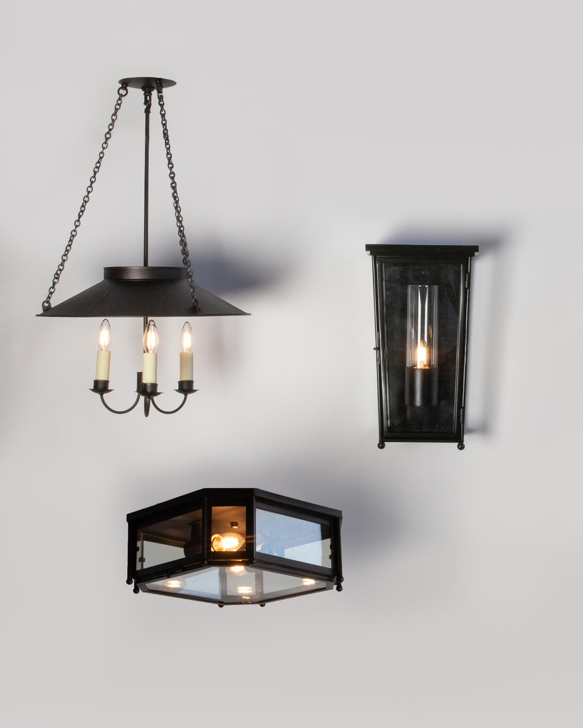 Remains Lighting’s Danbury pendant, Stamford flush mount and Waterbury wall lantern by Scofield 