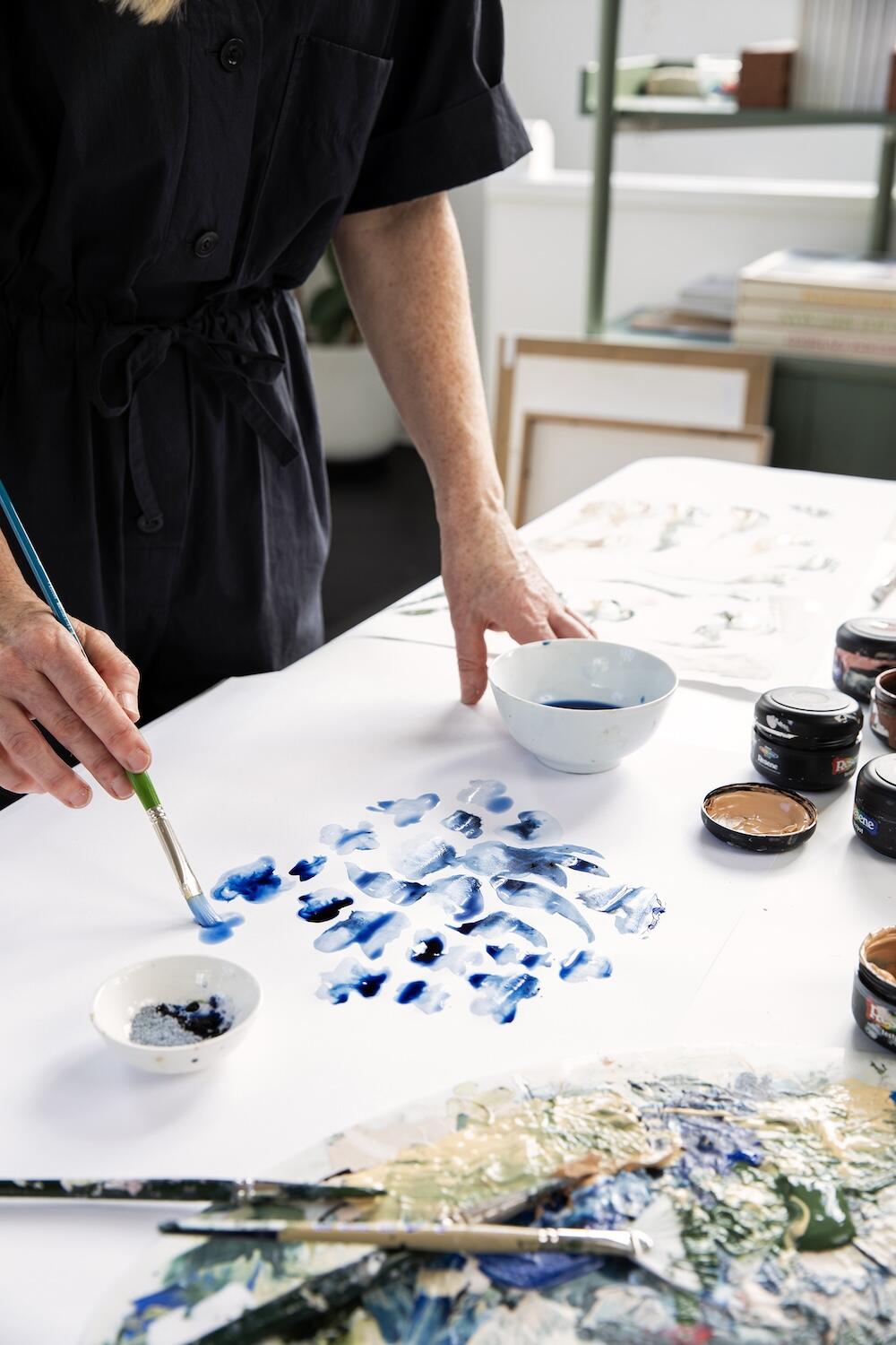 Hayes at work on a hand-painted motif