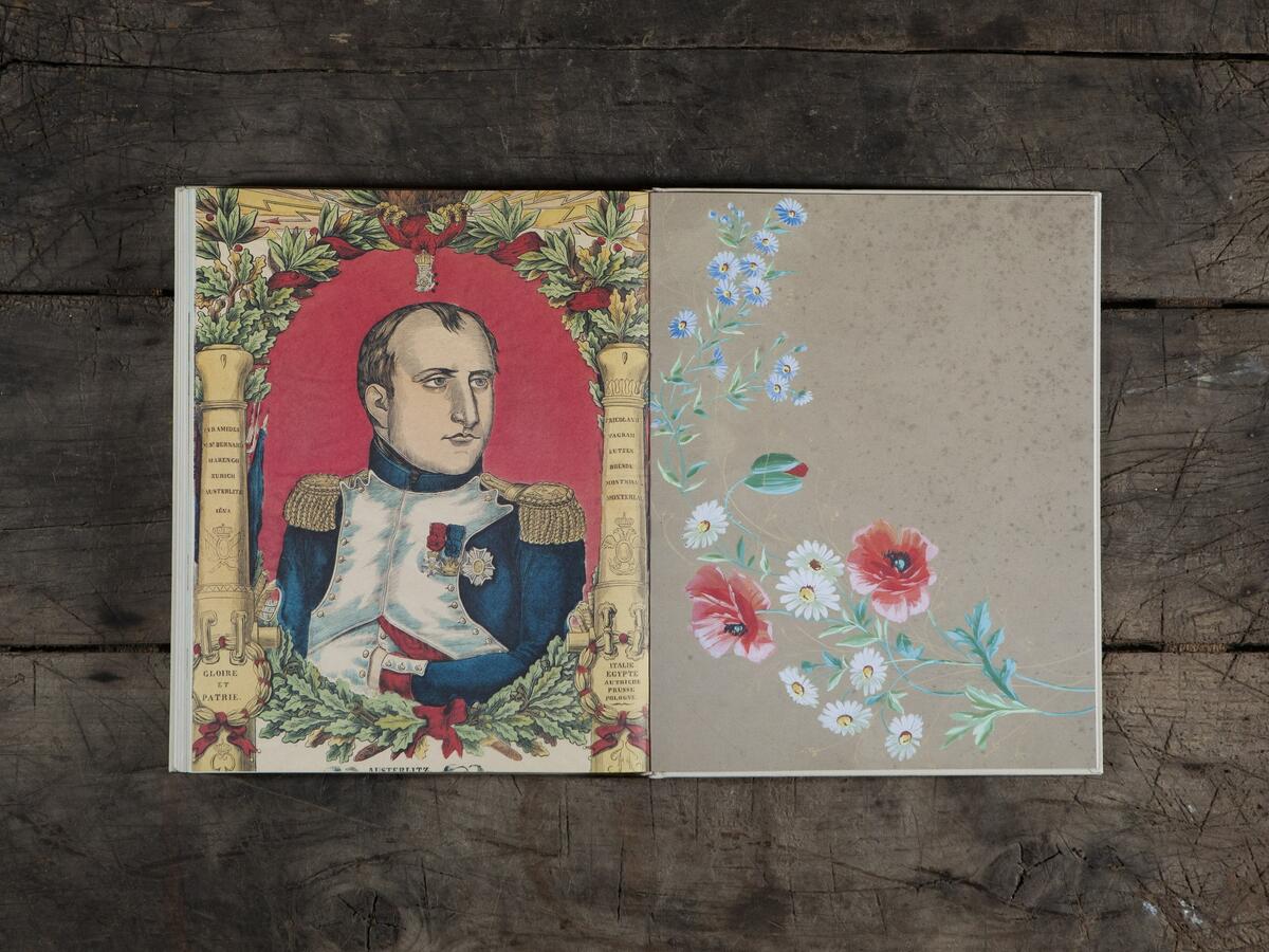 One of Derian’s favorite pages in his new book, “John Derian Picture Book II,” featuring Napoleon with a pink oval around him and some antique wallpaper.