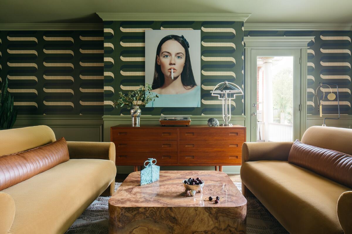 An undulating wallpaper envelopes this midcentury living space by Natalie Papier