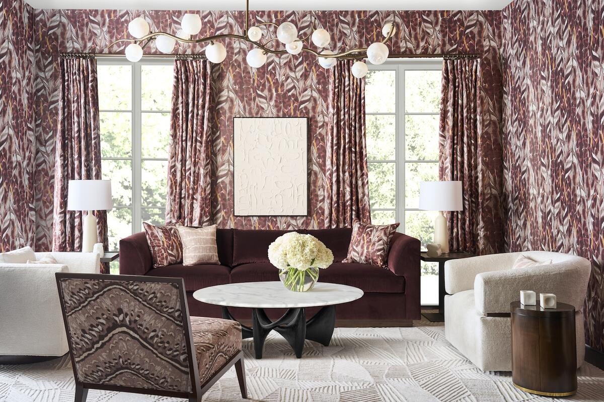 Selections from the Kravet Couture x Altuzarra collection, including Caspia wallpaper in Mulberry and a chair upholstered in Moth Weave in Mulberry