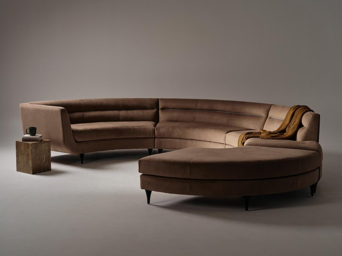 American Leather’s Menlo Park sofa by Rick Lee upholstered in Ultrasuede’s Desert Camel fabric