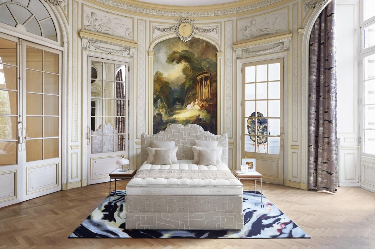 Tréca’s Versailles headboard and Auguste bed base upholstered in Liberabirinto by Dedar