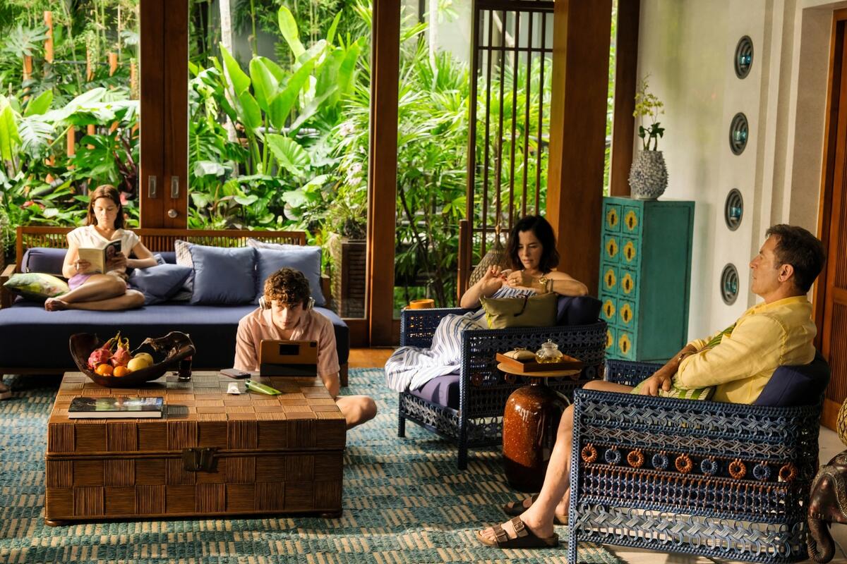 Sarah Catherine Hook, Sam Nivola, Parker Posey and Jason Isaacs in their character's villa in Thailand during season three of The White Lotus 