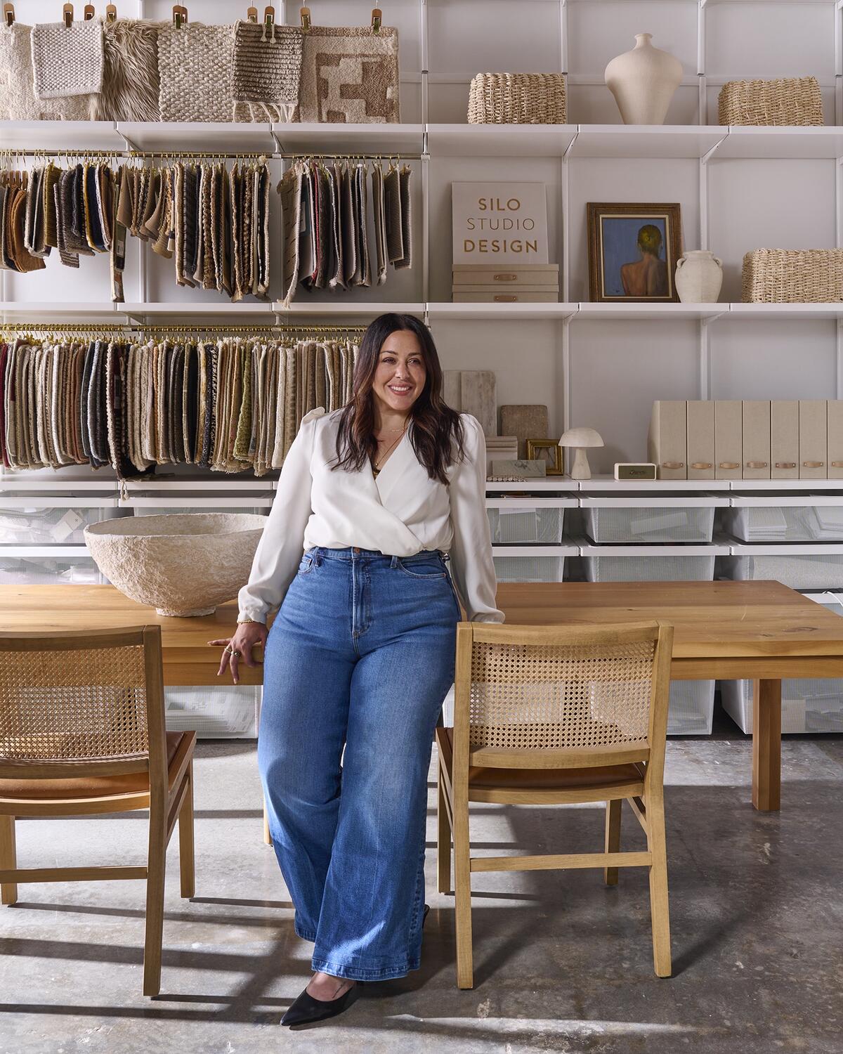 Gabriela Eisenhart’s golden-hour grouping of patinated brass, warm beige weaves and vintage carved wood