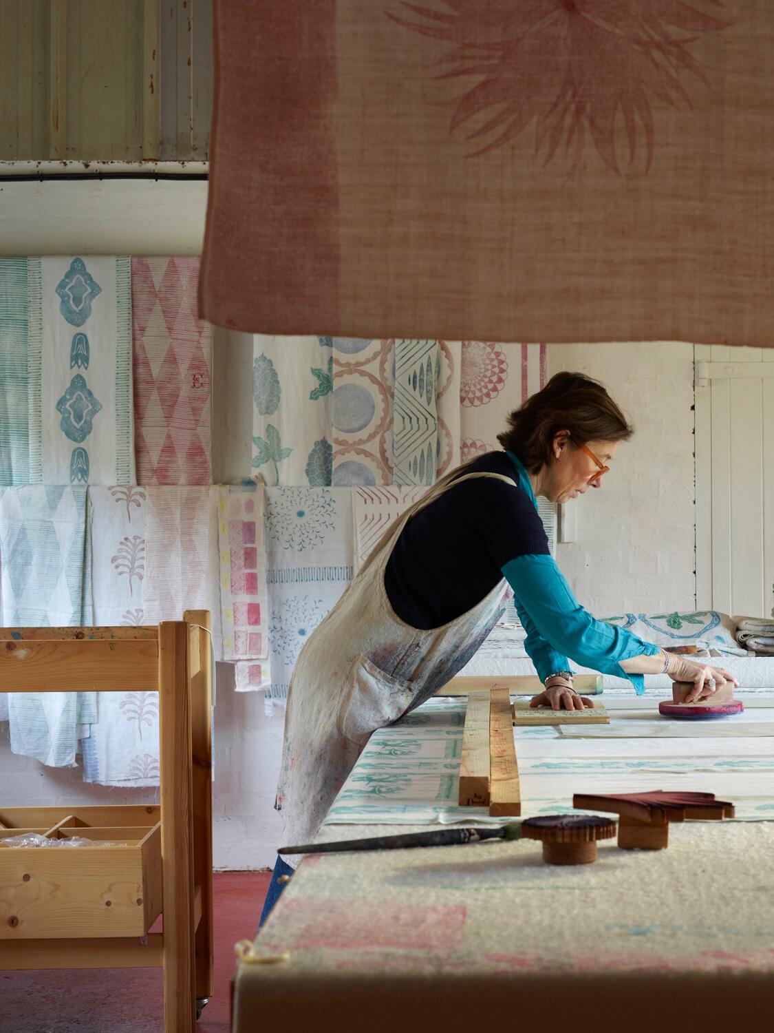 This English textile designer block-prints her designs by hand onto antique linens
