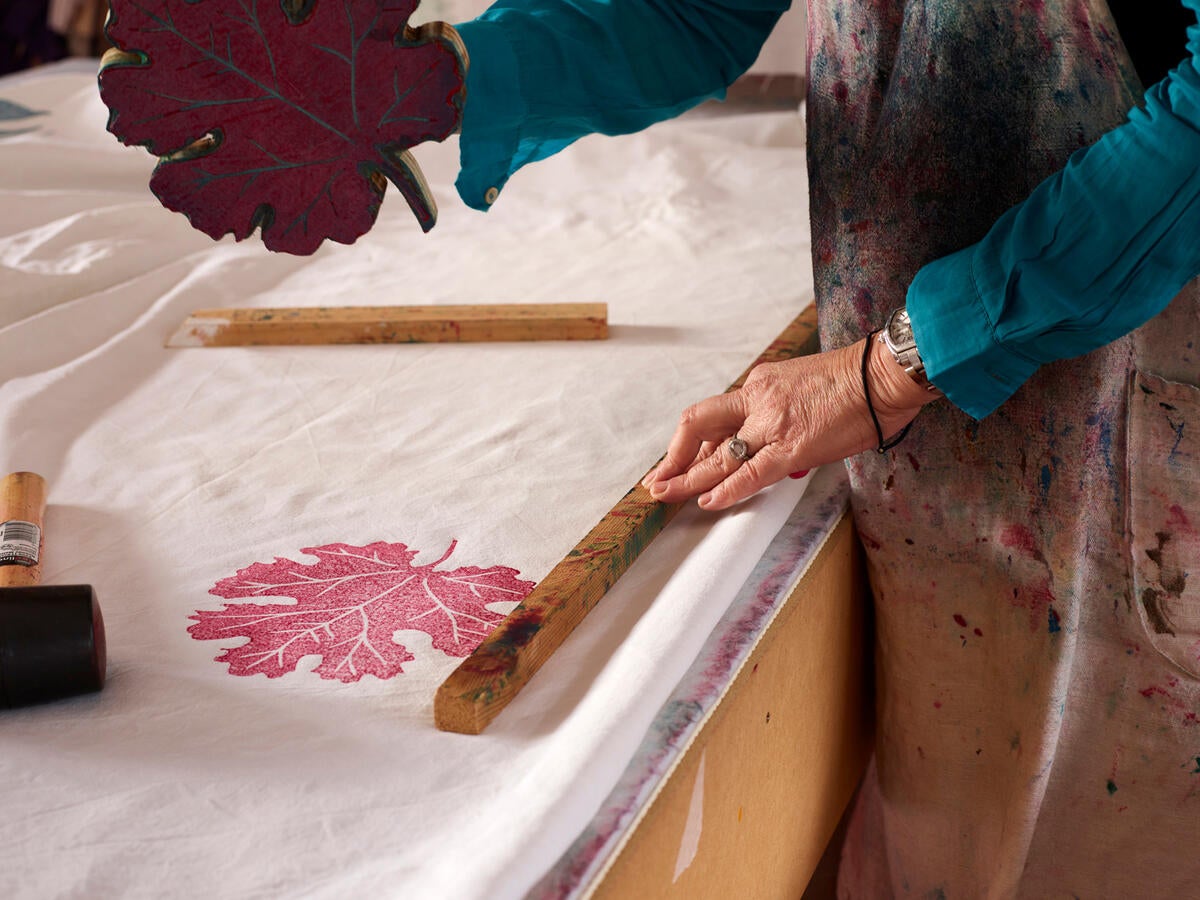 This English textile designer block-prints her designs by hand onto antique linens