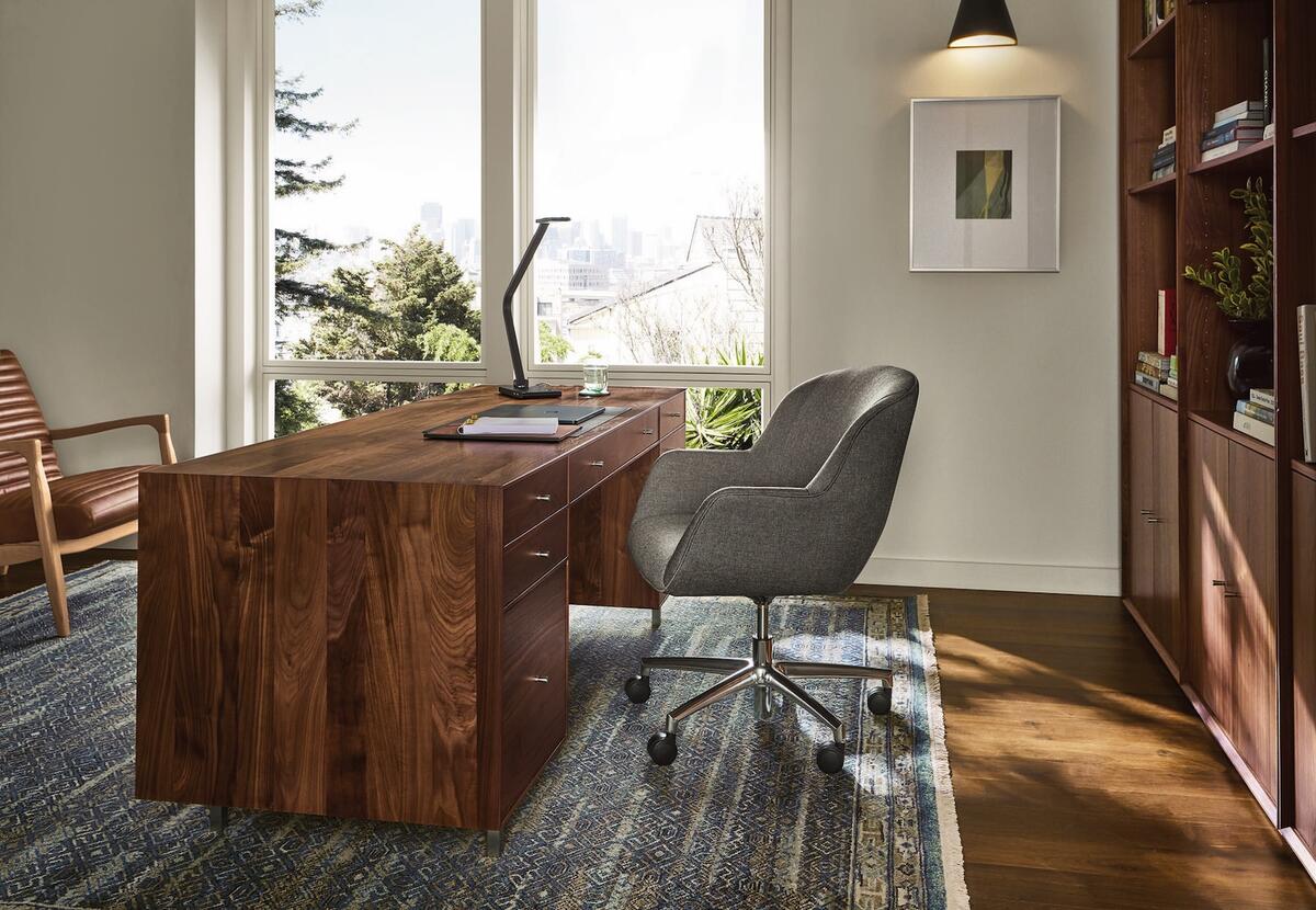 The Hudson executive desk in Walnut and the Penny office chair in Kesler Slate fabric by Room & Board 