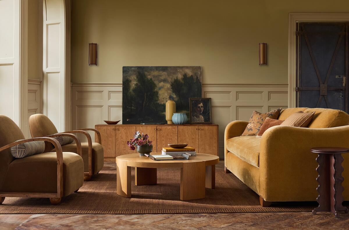 Selections from the second Pierce & Ward x West Elm collection, including the Arched Burl armchair (left) and the Scalloped drink table (right) 