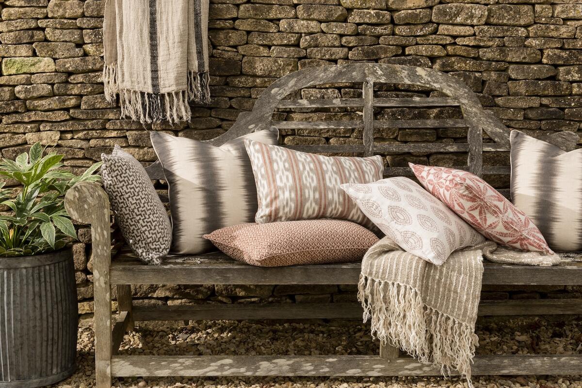 Selections from The Pure Edit collection at Kravet, including Aarna fabric in Graphite (second from left) and Marra in Persimmon