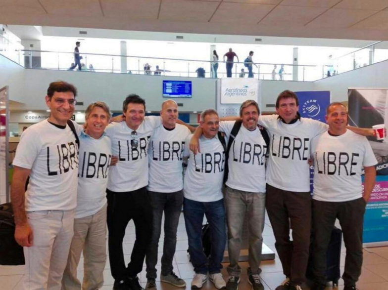 Left to right: Hernan Ferruchi, Alejandro Pagnucco, Ariel Erlij, Ivan Brajckovic, Juan Pablo Trevisan, Hernan Mendoza, Diego Angelini and Ariel Benvenuto, before flying from Argentina to New York. Mendoza, Angelini, Pagnucco, Erlij and Ferruchi were killed in the attack; courtesy of Trevisan family via AP