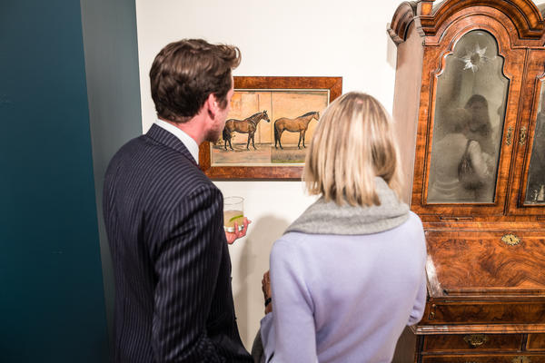 Guests viewing the Decorative Arts Sales exhibition 