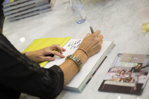 Cortney Novogratz signs a copy of her book. 