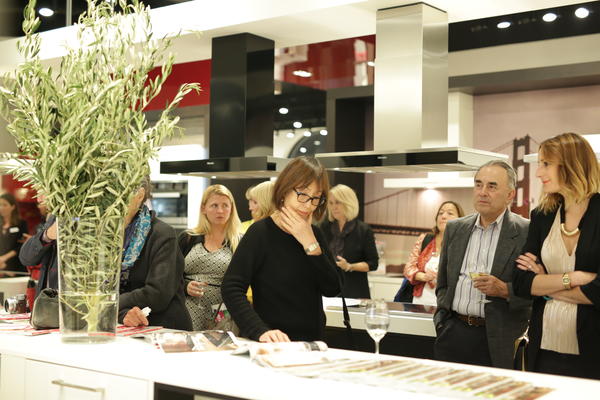 Guests look at Hearst Design Group magazines. 