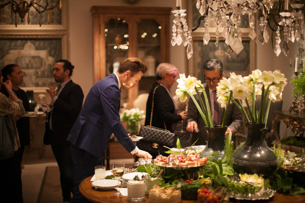 Guests enjoy hors d'oeuvres at the party. 