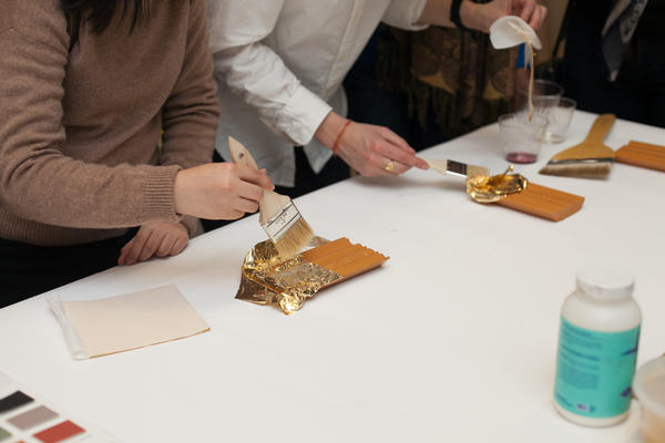 The group tries gilding on their own.