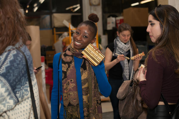 NYSID student Funke Ogunleye with her self-gilded molding 
