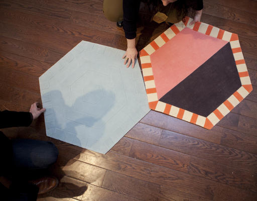 Attendees get a better feel for the modular rugs of the Kinder Ground series.