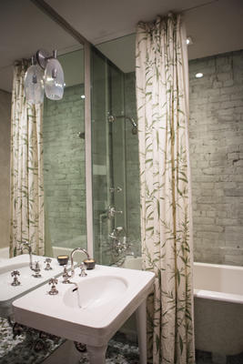 Textures and prints bring the upstairs bathroom to life.