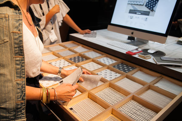 Guests selecting swatches of the Nate Berkus collection