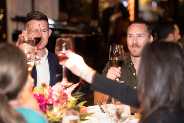 Guests toast during dinner.