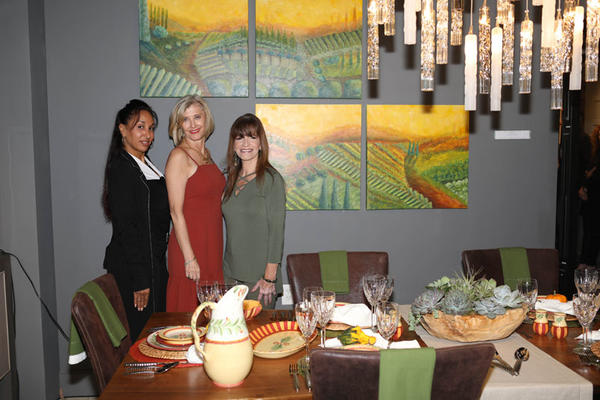 Designer Julie Schuster (center) with design associate Maggie Vergara and artist Debbie Viola