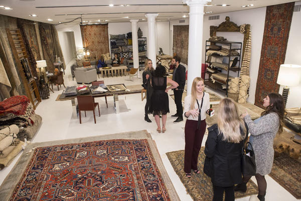 Guests mingle on the second floor of the showroom. 
