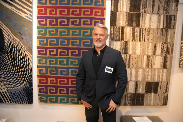 Patrick Hamilton in front of his rug design