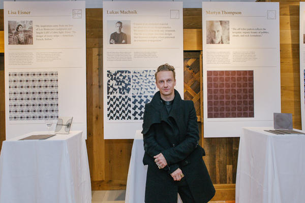 Lukas Machnik in front of his tile design