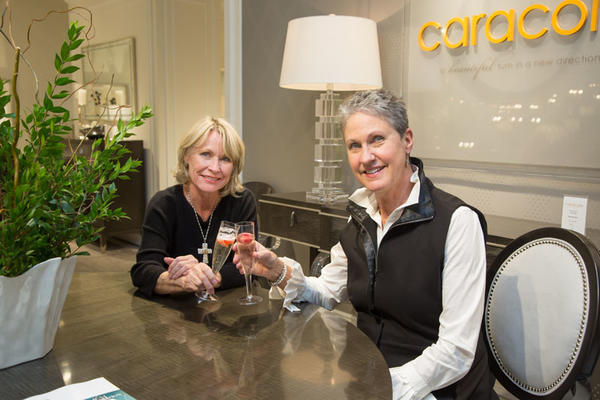 Caracole customers enjoying a toast with bubbly