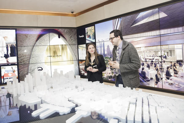 Guests view the Hudson Yards model. 