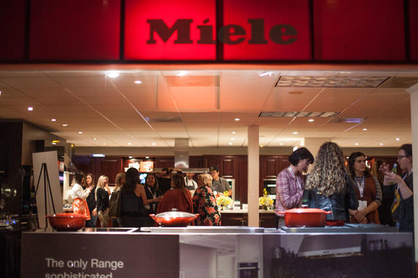 Design Blogger attendees mixing and mingling in the Miele showroom