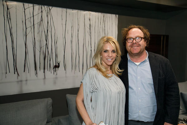 Showroom co-owner Jennifer Astrop and artist Todd Murphy pose in front of one of his featured works at the ‘Todd Murphy: A Solo Exhibition’ in the Minotti by HA Modern showroom during Design ADAC.