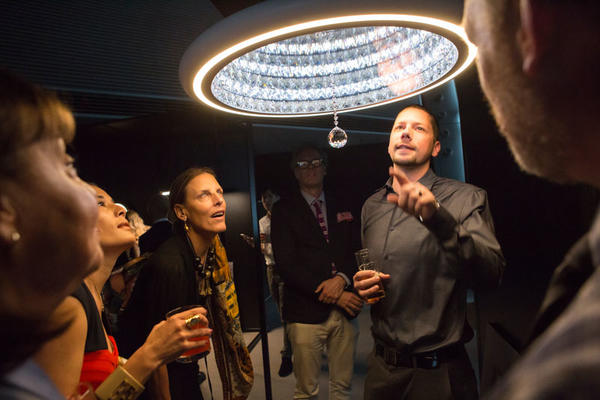 Guests learning about Swarovski Lighting’s Infinite Aura collection