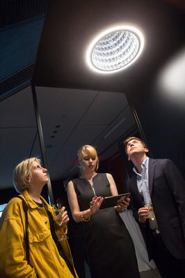 Petra Oberhauser demonstrating how guests can control Swarovski Lighting’s Infinite Aura collection through the app