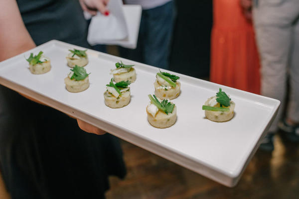 Guests snack on hors d’oeuvres.