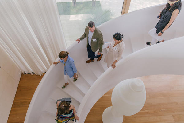 Guests descend Kelly Behun's staircase.