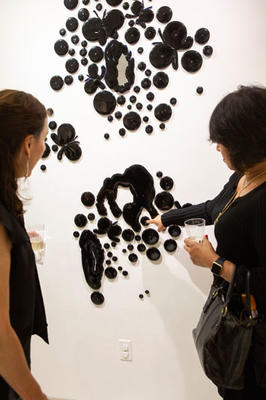 Jessica Bogdan, Allsteel Office and Jaz Rupall of Build Capital admires "Black Pool" by Roby Wynne.