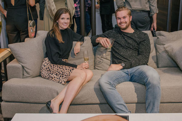 Dillon Harding of Chanel (right) tests out a Liaigre sofa with a pal.